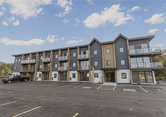 Exterior with balconies and parking