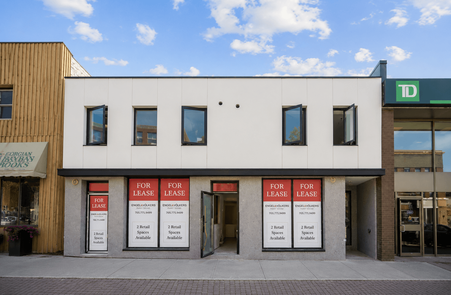 A downtown Parry Sound storefront with Engel & Völkers for-lease signs in the windows.
